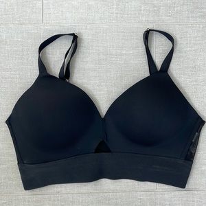 Spanx Black sports bra also can be used as swim bikini top. Built in cups!